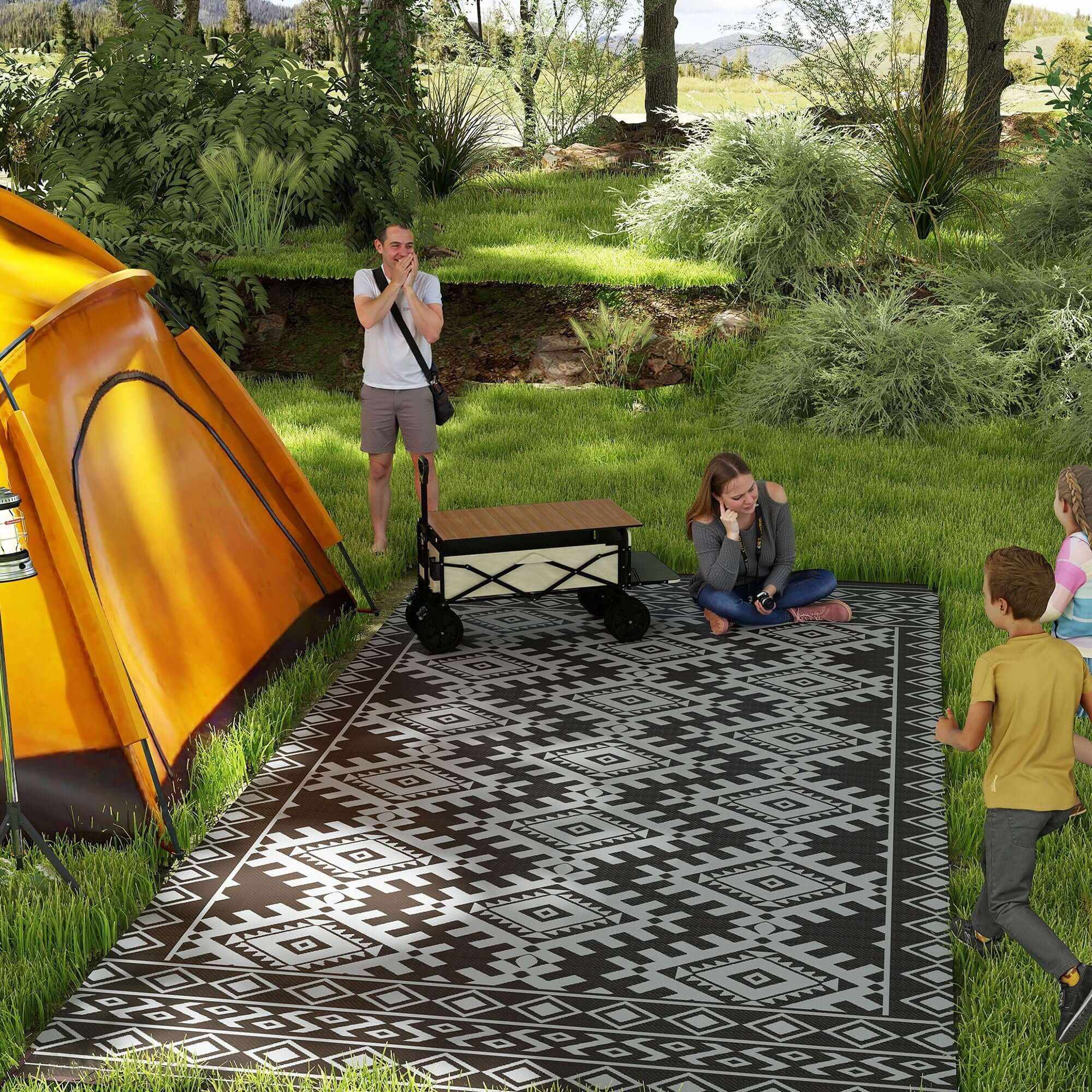 Black and gray reversible waterproof outdoor rug with rhombus border and carry bag