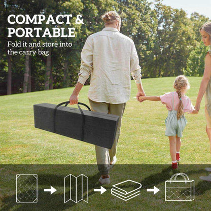 Reversible Waterproof Outdoor Rug folded and carried in bag by family, showcasing compact and portable design.